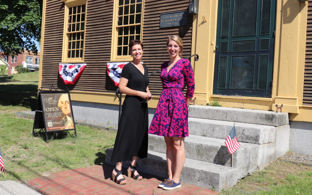 Riverwoods Exeter and AIM representatives standing in front of the Folsom Tavern