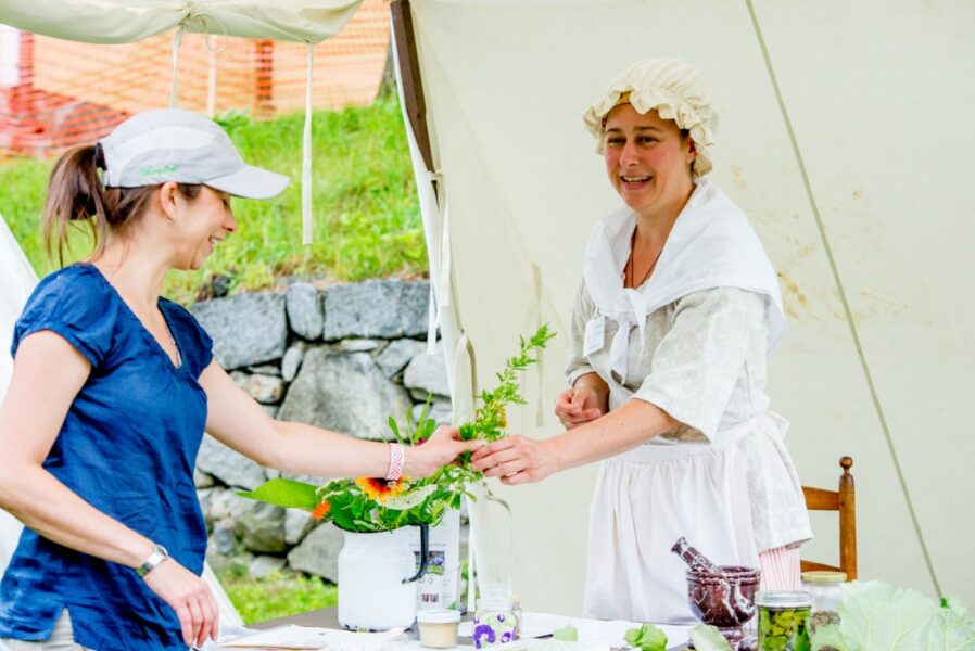 Artisan engages with guest at American Independence Festival